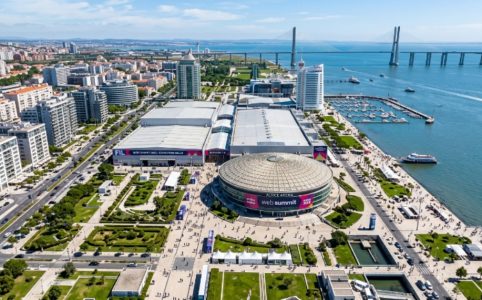 Aerial view of the Altice Arena and FIL exhibition centre in Parque das Nações, Lisbon, the venue for Web Summit 2026, surrounded by the Tagus River waterfront